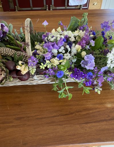 Gardeners basket of locally grown farewell flowers and vegetables, Ledbury